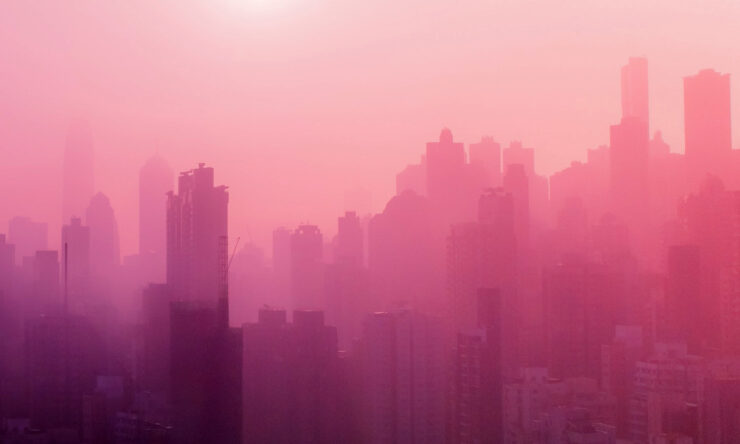 Photo of a city skyline with a pink monochrome filter overlay
